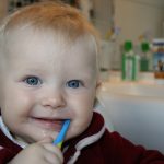 Boy learning to brush his teeth in ABA in Toronto